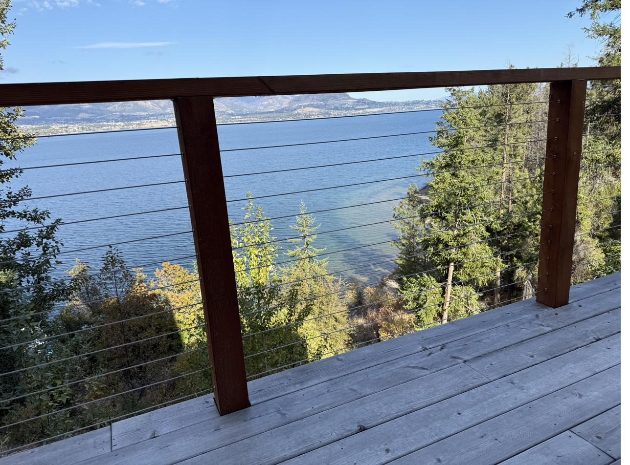 Custom railings and cable systems preserving an Okanagan view